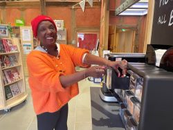Customer using coffee machine at Ledbury Library